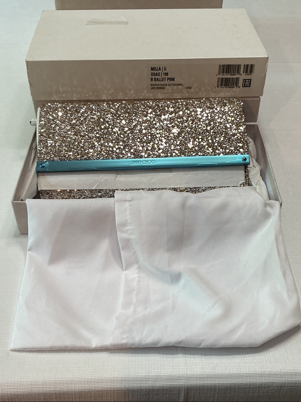Jimmy Choo Glitter Clutch in Ballet Pink.
New in box.